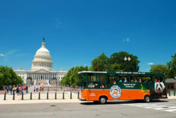 old town trolley passing us capitol building in washington dc, a good rainy day activity