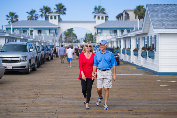 Couple walking in La Jolla holding hands