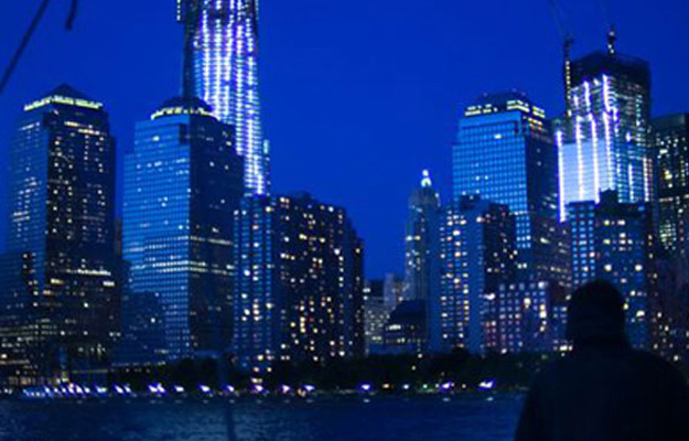 View of New York Skyline at night from Harbor